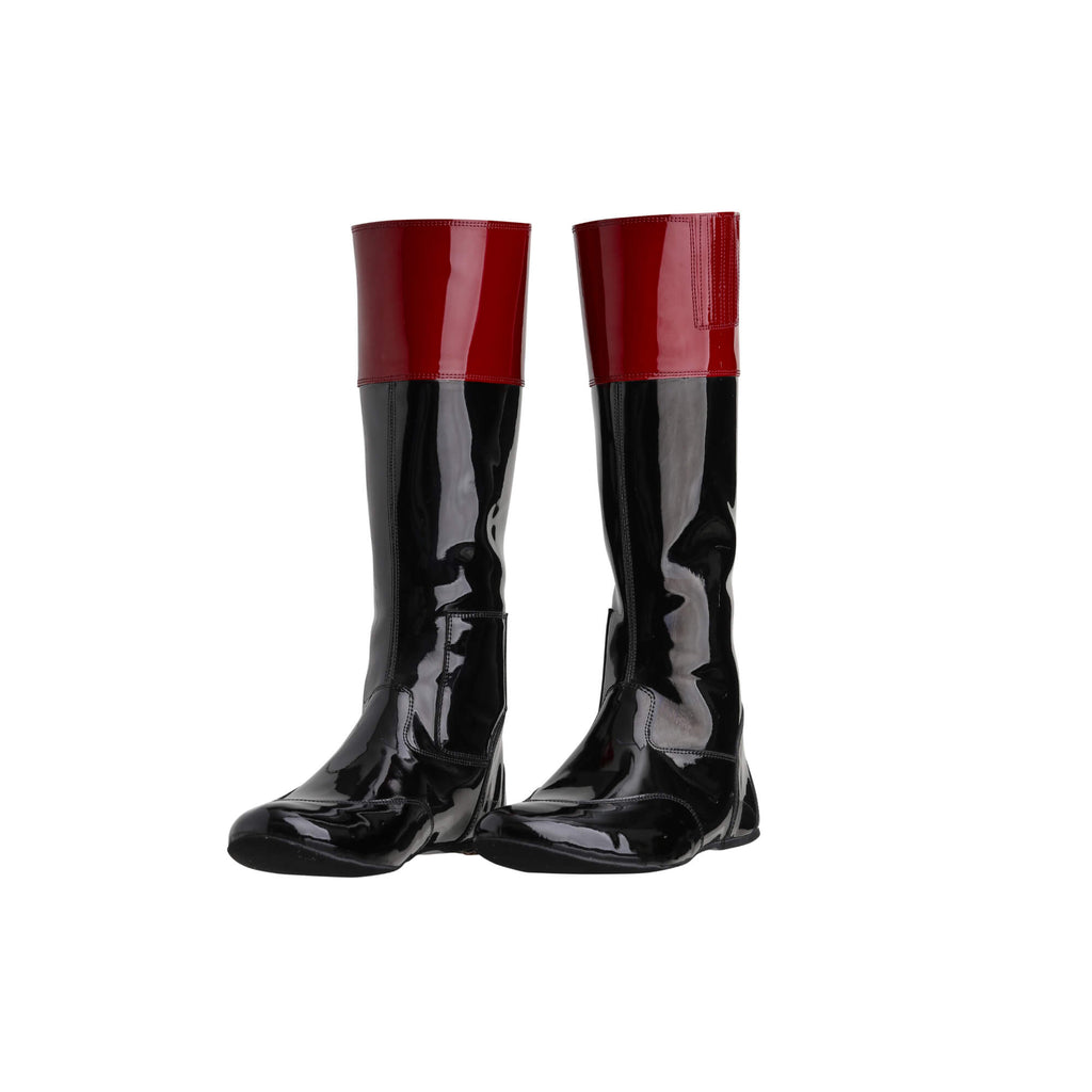 A pair of tall racing boots displayed on a white background. The boots are made of black material with a dark red patent leather accent around the calf area. They feature a back zip and a 1.5-2cm stretch feature around the calf. Both shoes are positioned sole down with the zipper done, angled slightly to one side.