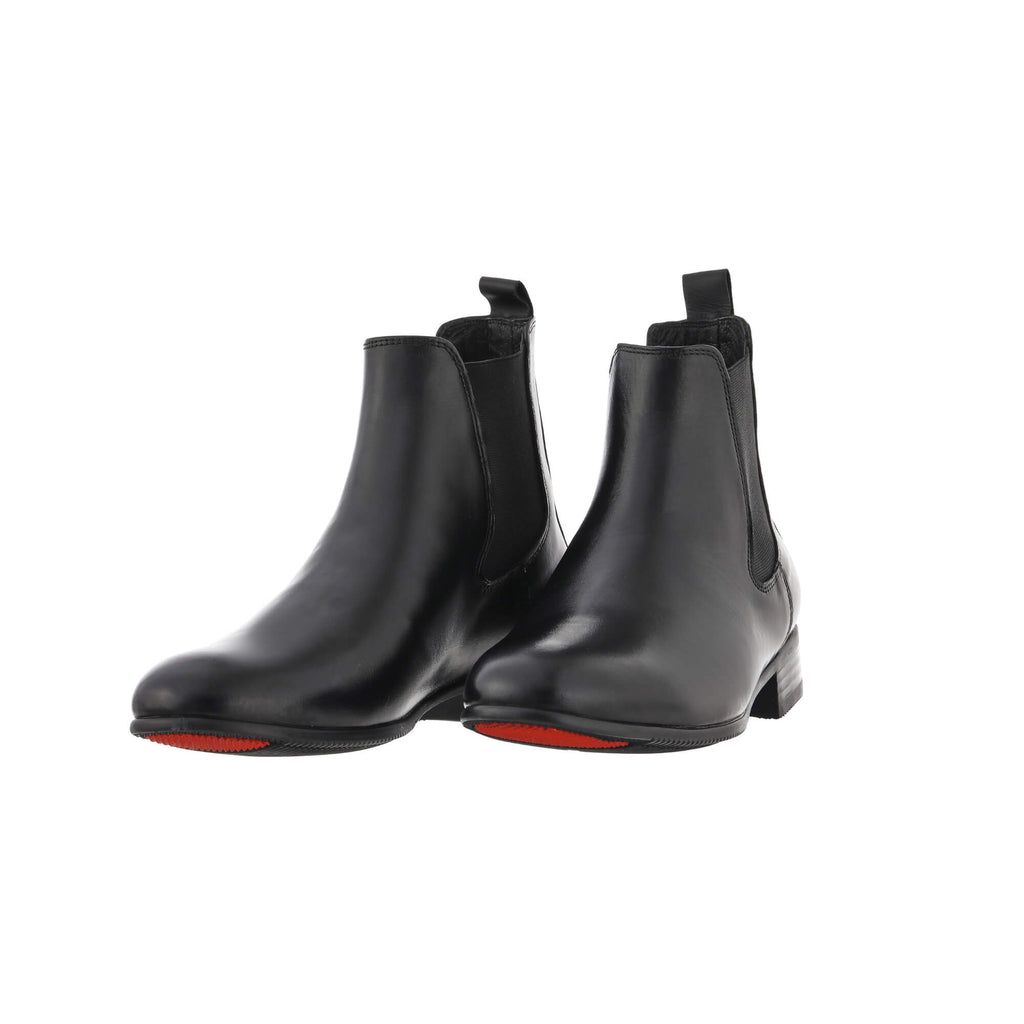 A pair of classic black short boots with a slide-on design, showcased against a white background. The pair is displayed sole down, slightly angled to one side for a stylish presentation.