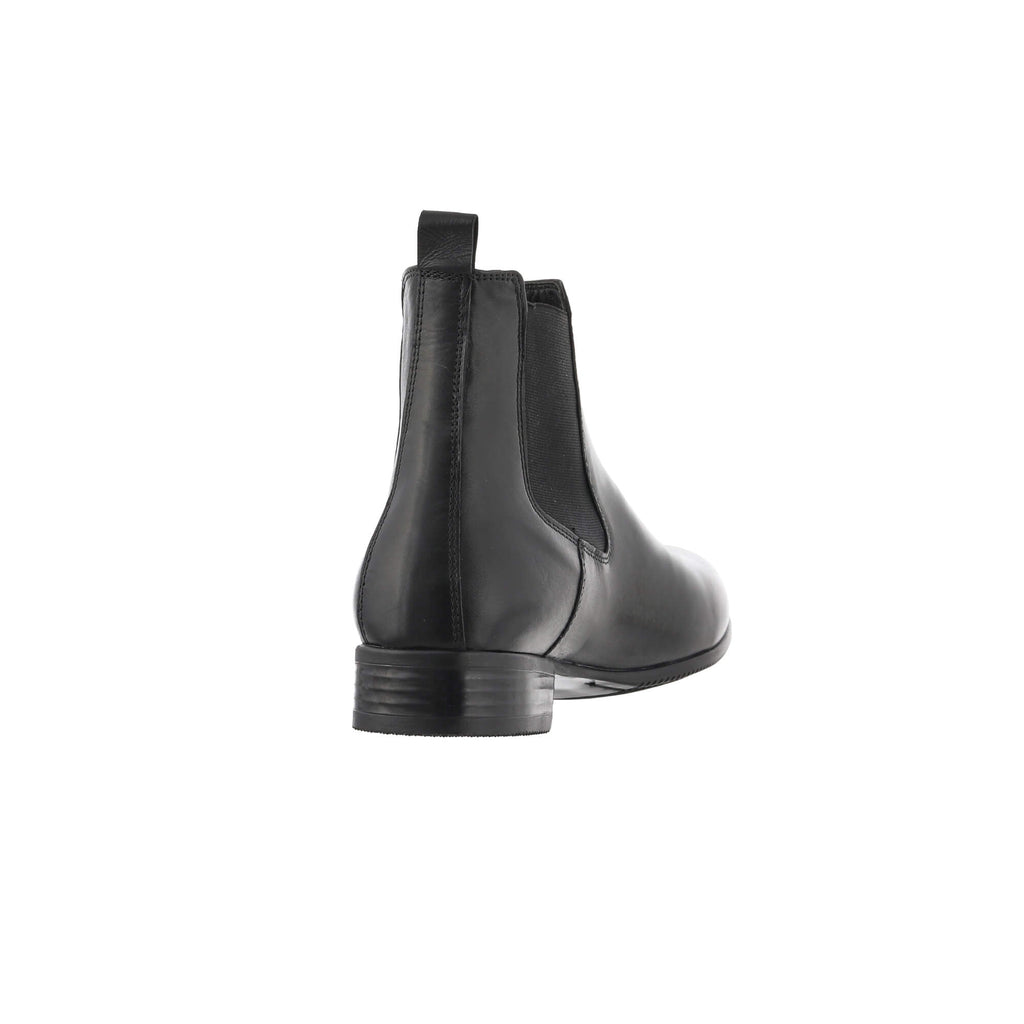 A single classic black short boot with a slide-on design, displayed against a white background from the back perspective.