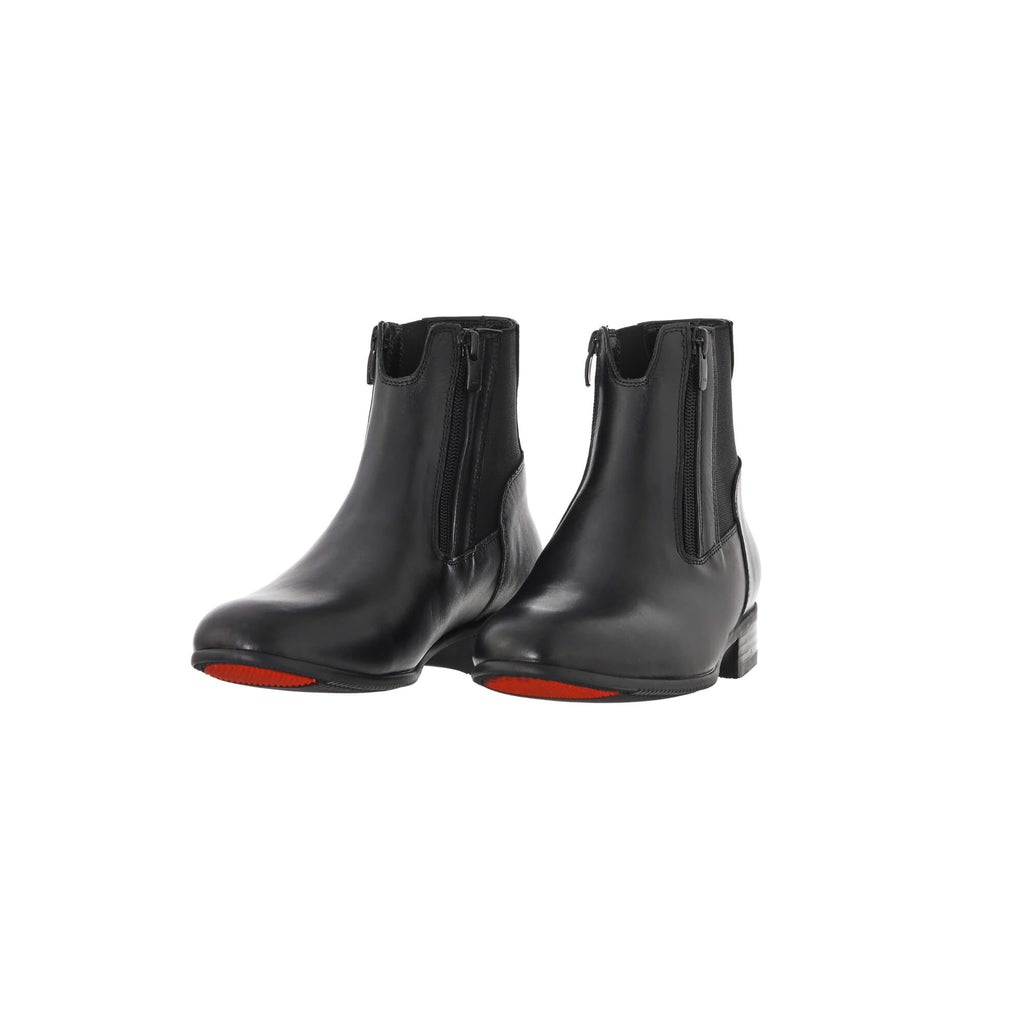 A pair of classic black short boots featuring double front zip and a gap on the top front to provide extra comfort when horse riding. Presented on a white background. The pair is displayed sole down with zipper done, with the angle slightly positioned to one side.