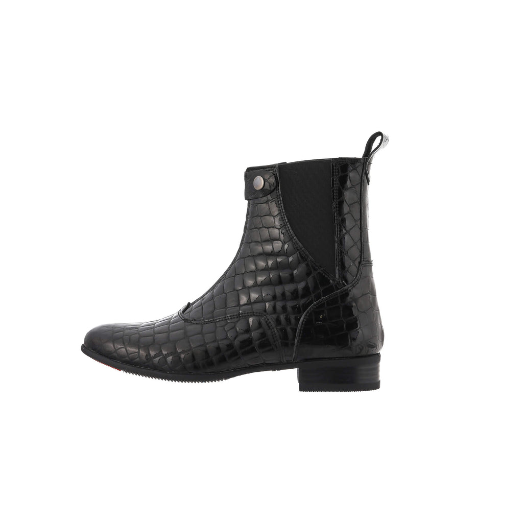 A side perspective of a single black crocodile leather short boot with a front zip and buckle, set against a white background.