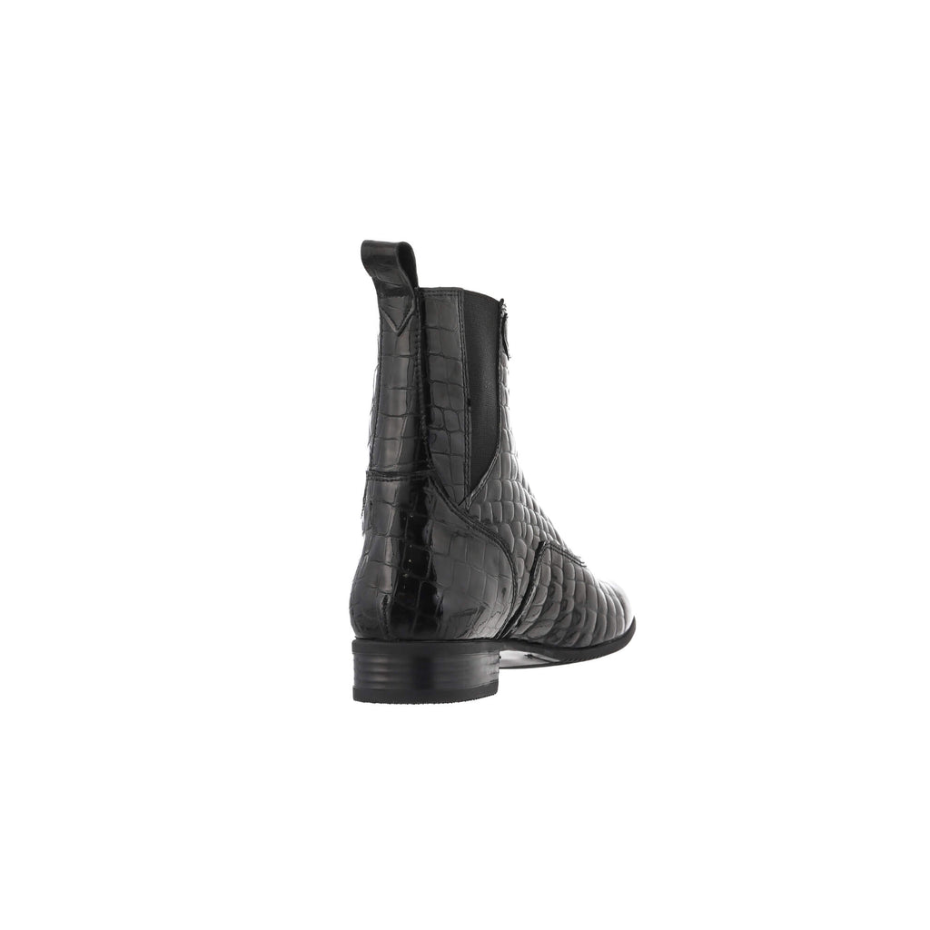 A back perspective of a single black crocodile leather short boot featuring a front zip with a buckle, against a white background.