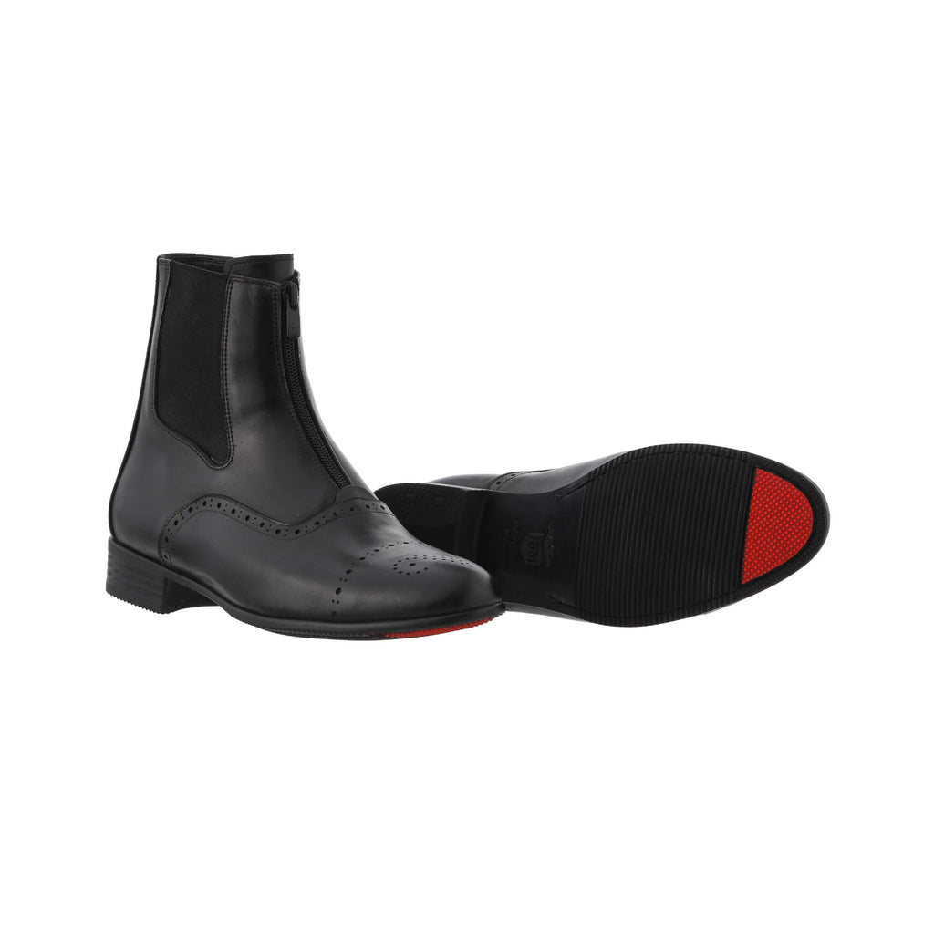 A pair of black leather wingtip-style boots with a front zip and zipper overlay, set against a white background. One shoe is displayed sole down with the zipper done, while the other shoe is laid down to showcase the sole featuring a red tip as their signature sole design.