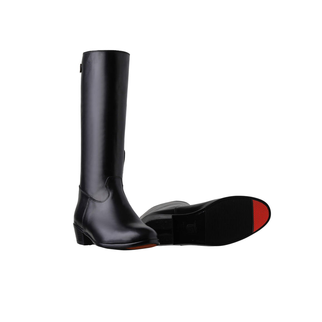 A pair of tall black leather Cuban heel boots with a back zip, displayed against a white background. One boot is positioned sole down with the zipper done, while the other boot is laid down to showcase the sole featuring a red tip design.