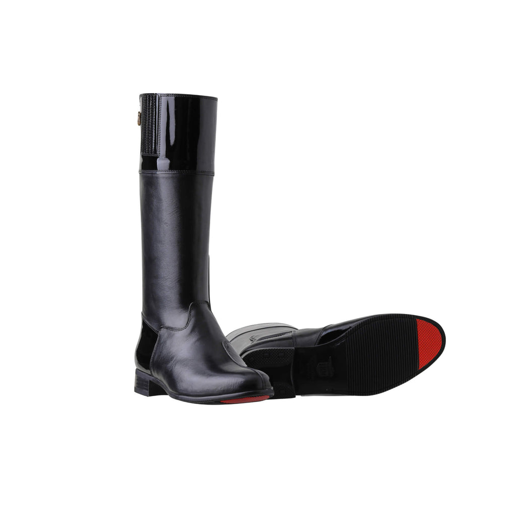 A pair of tall boots displayed against a white background. The boots feature classic black leather with black patent leather accents, a back zip, and a 1.5-2cm stretch feature on the calf area. One boot is positioned sole down with the zipper done, while the other boot is laid down to showcase the sole, which features a red tip design.