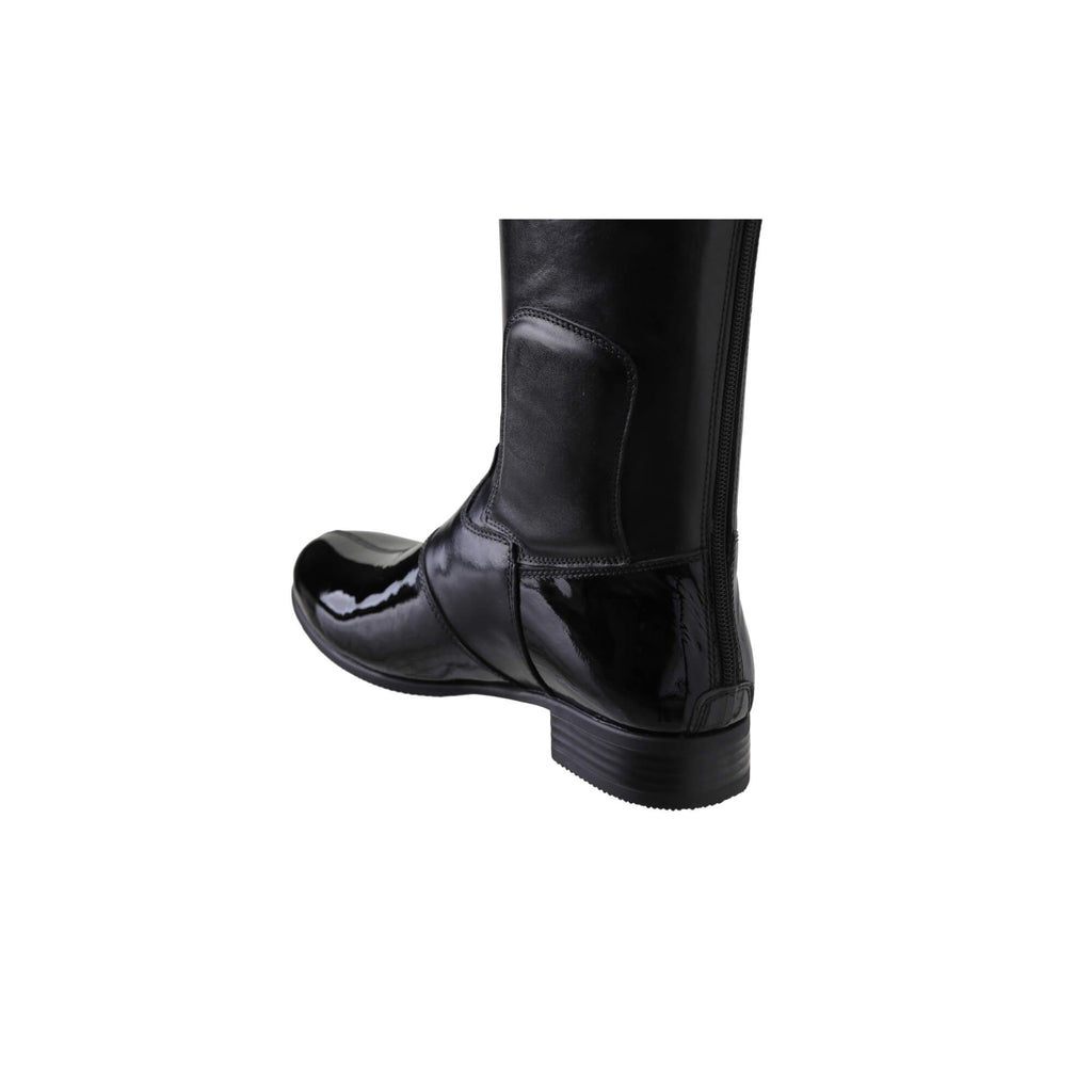 A single tall boot displayed against a white background. The boot features classic black leather with black patent leather accents, a back zip, and a 1.5-2cm stretch feature on the calf area. The image displays the back perspective of the boot.