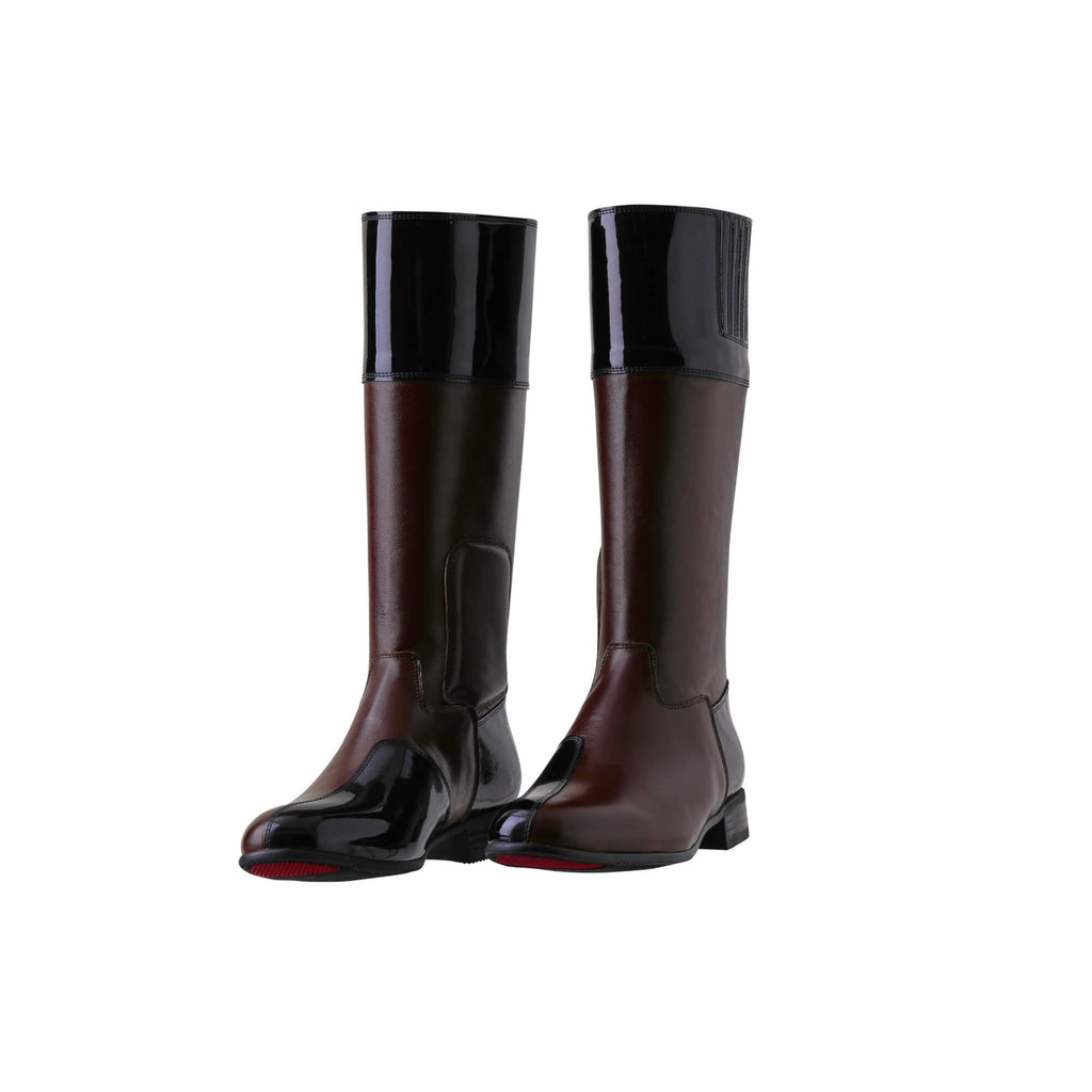 A pair of brown tall boots with black patent accents on the top and bottom. Features a back zip and a 1.5 - 2cm ability to loosen the calf area if required. Displayed against a white background with the soles down. The zips are done, and the boots are slightly positioned to one side.