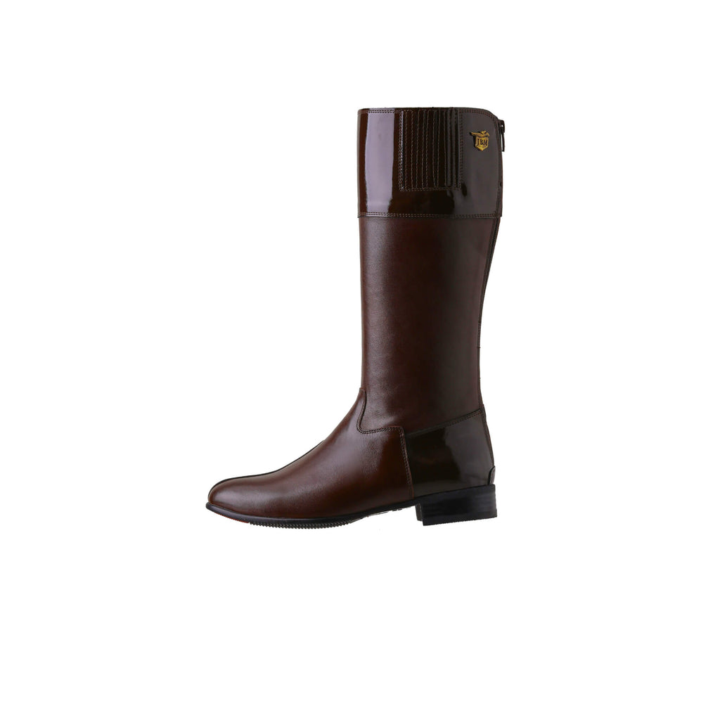 A single tall racing boot displayed against a white background. Made of brown leather with brown patent leather wrapping around the calf, it features a back zip and a 1.5-2cm stretch feature on the calf area. The boot is shown from a side perspective.