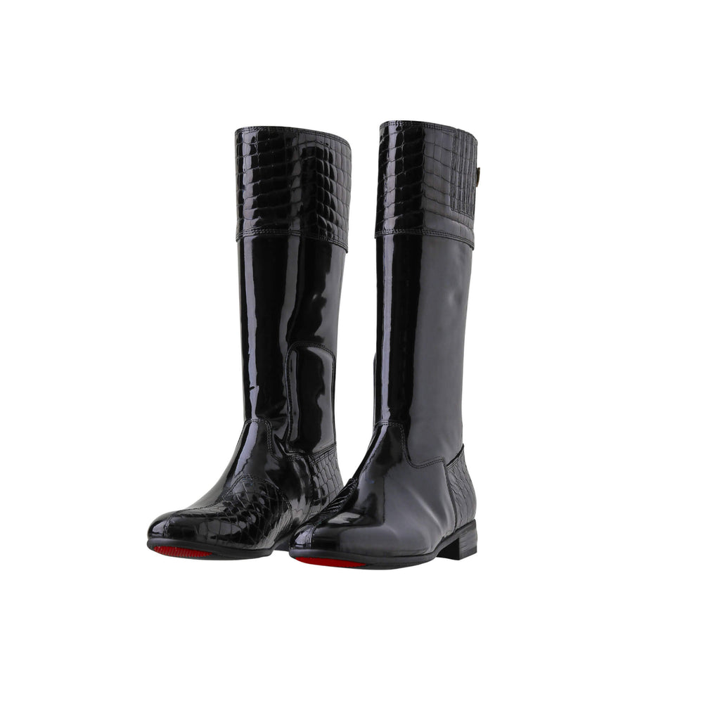 A pair of tall black patent leather and black crocodile leather accent boots displayed against a white background. The boots feature a back zip and a 1.5-2cm stretch feature on the calf area. Both shoes are positioned sole down with the zipper done, and the angle of the boots is slightly positioned to one side.