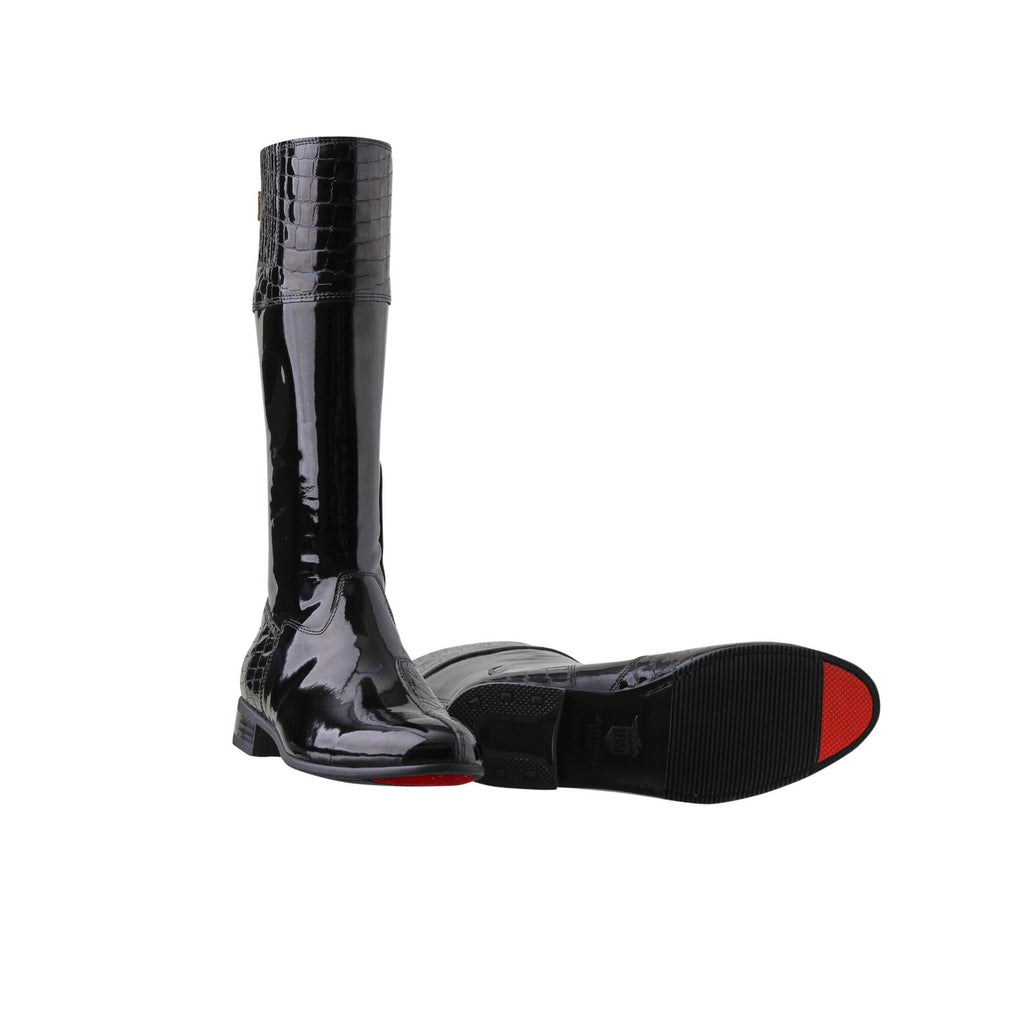 A pair of tall black patent leather and black crocodile leather accent boots displayed against a white background. The boots feature a back zip and a 1.5-2cm stretch feature on the calf area. One boot is positioned sole down with the zipper done, while the other boot is laid down to showcase the sole featuring a red tip design.