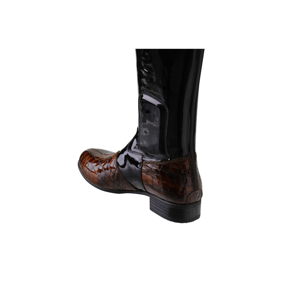 A single tall boot displayed against a white background. The boot features black patent leather with brown crocodile leather accents. It has a back zip and a 1.5-2cm stretch feature on the calf area. The image displays the boot from a back perspective.