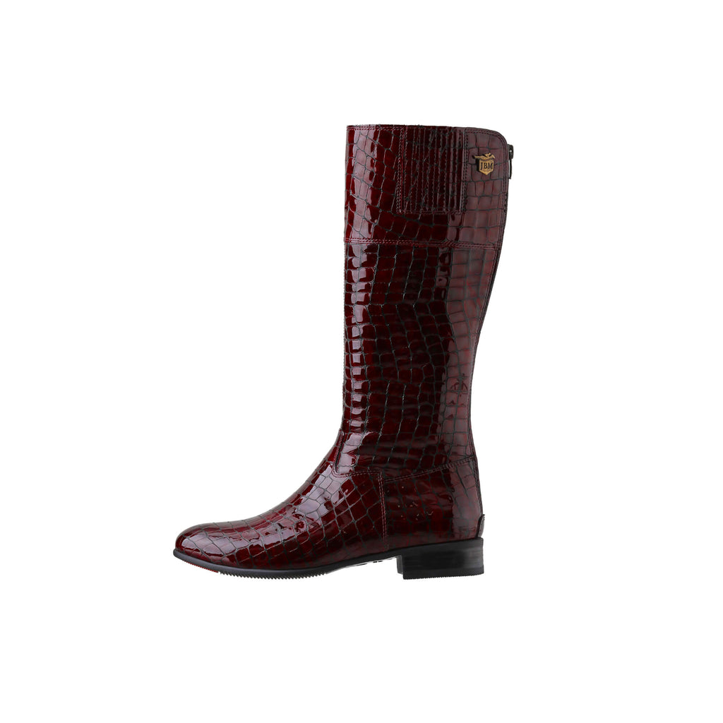  Image of a tall burgundy crocodile leather boot displayed against a white background. The boot features a back zip and a 1.5-2cm stretch feature on the calf area. This image only showcases one boot from a side perspective.