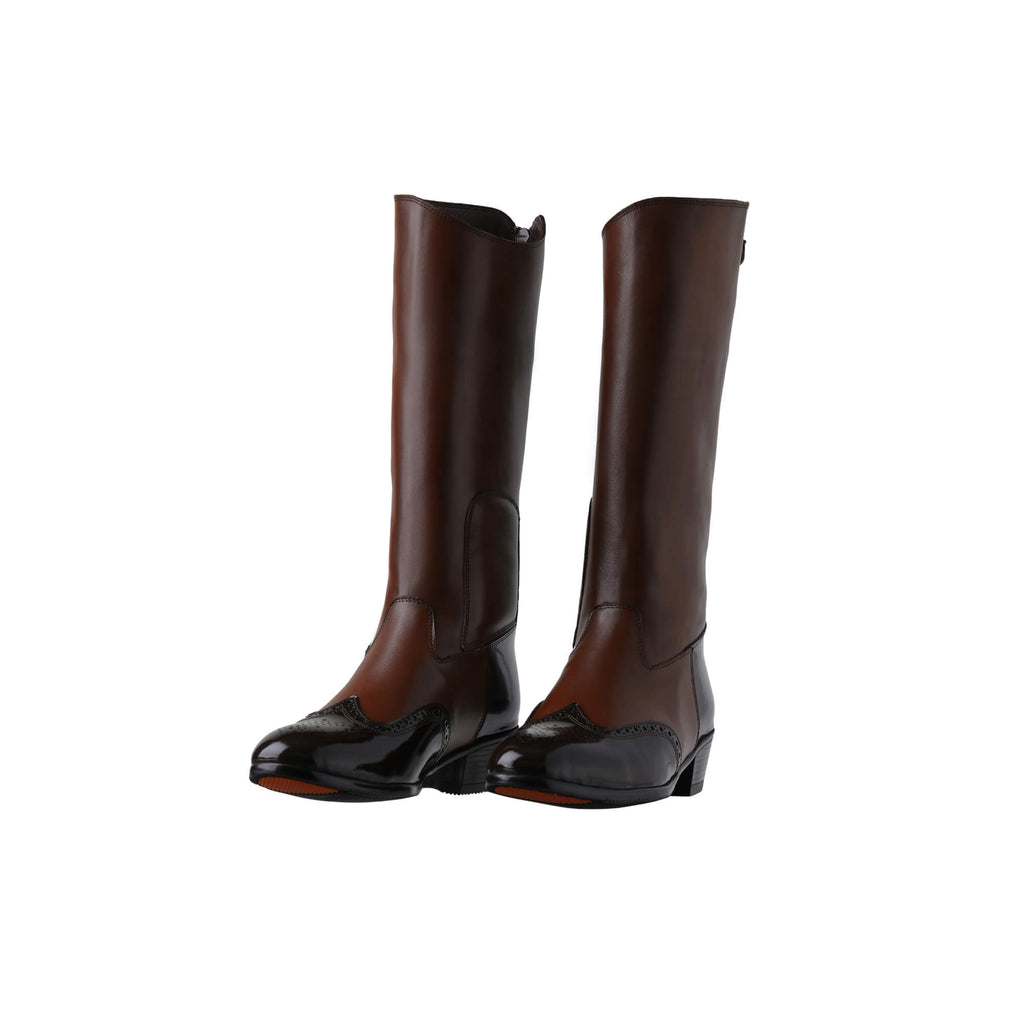 A pair of tall brown leather Cuban heel boots with brown wingtip accents. The boots feature a back zip and are displayed against a white background. Both shoes are positioned sole down with the zipper done, and the angle of the boots slightly positioned to one side.